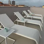 Eleven & Habitación en casa particular Olbia