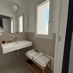 Eleven & Habitación en casa particular Olbia